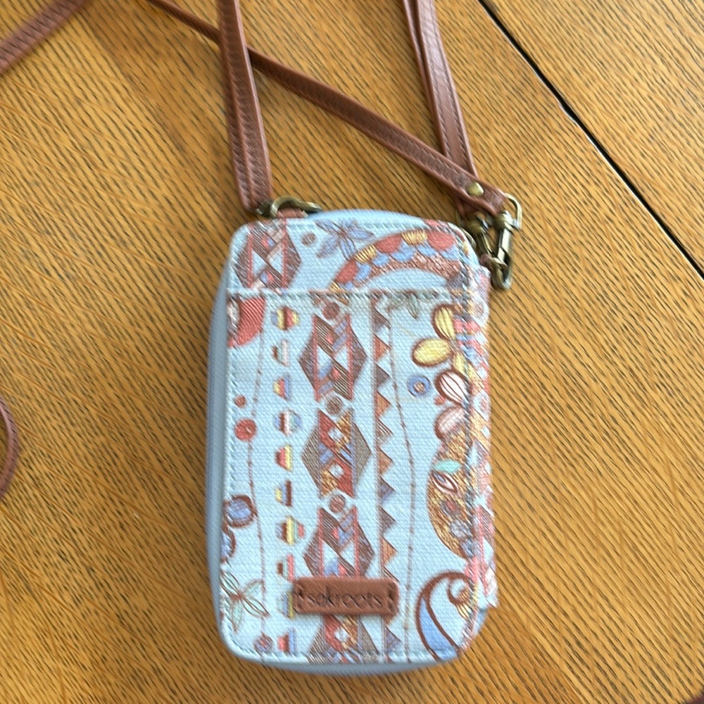Phone wallet by Sakroots, wrist and shoulder strap